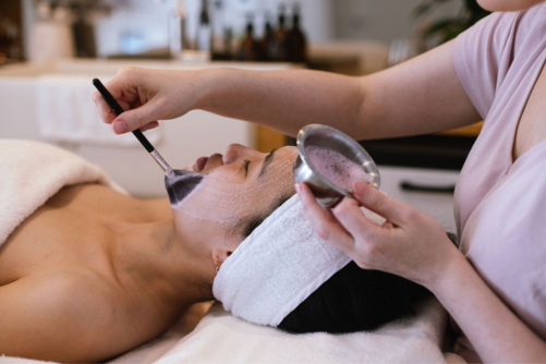 A calming facial treatment in a soft, warm studio