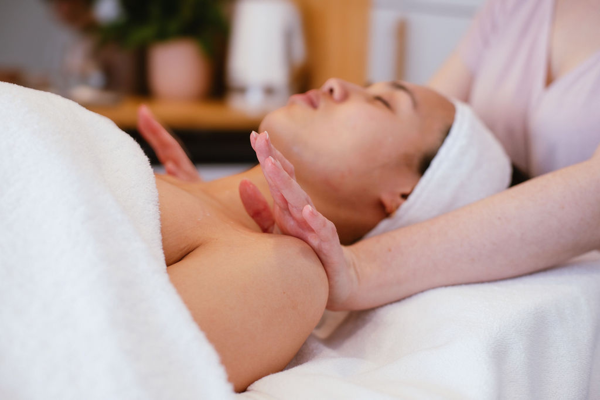 A client resting peacefully during a facial in the studio