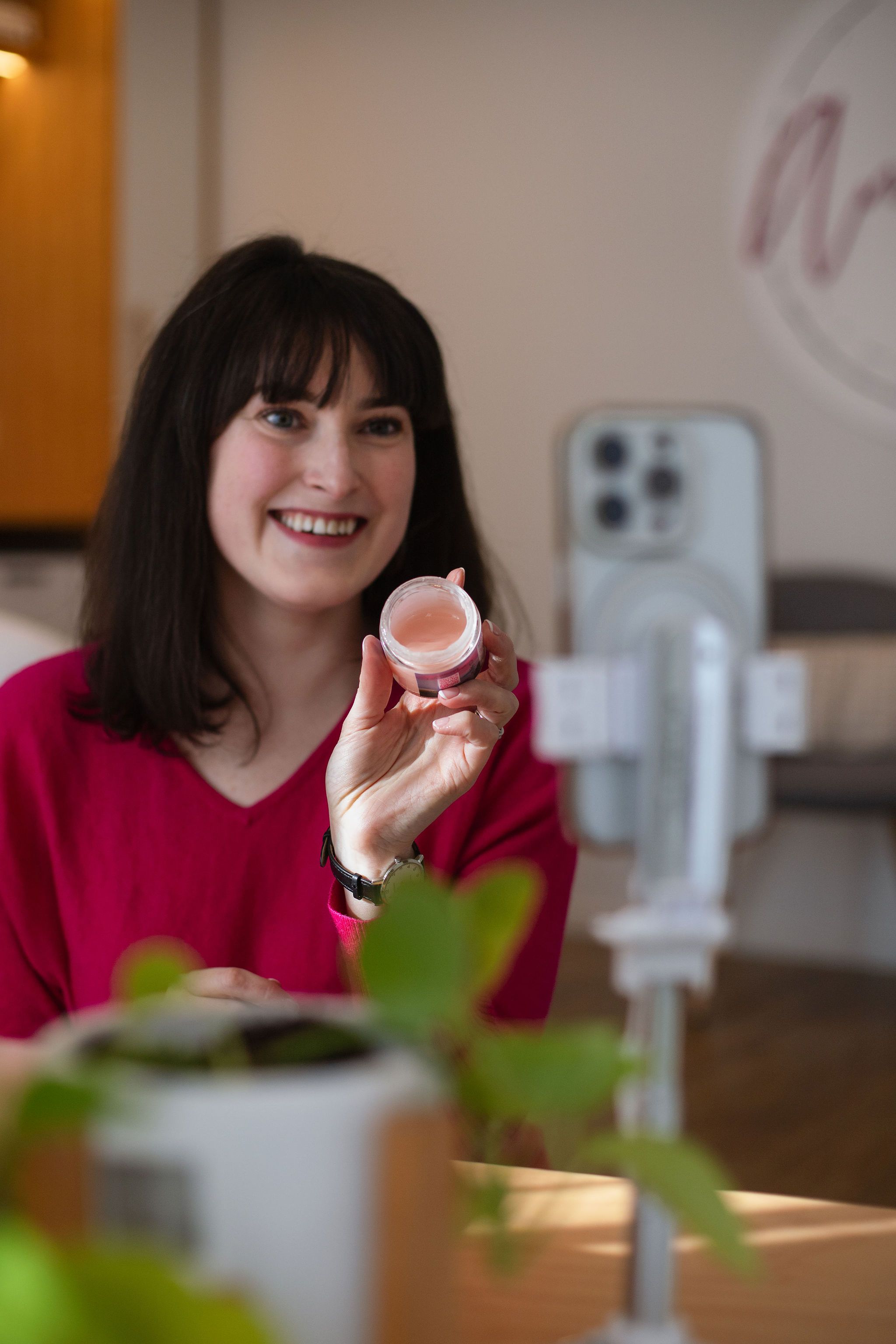 A woman with clear, healthy skin in soft light